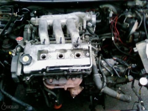 1993 Ford Probe - Close-up view of an engine bay, showing the intake manifold and valve cover.