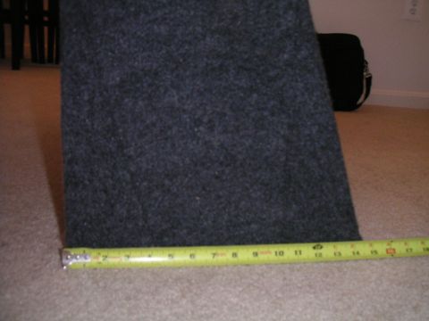 1994 Ford Bronco - A tape measure is placed next to a carpeted box, showing its dimensions.