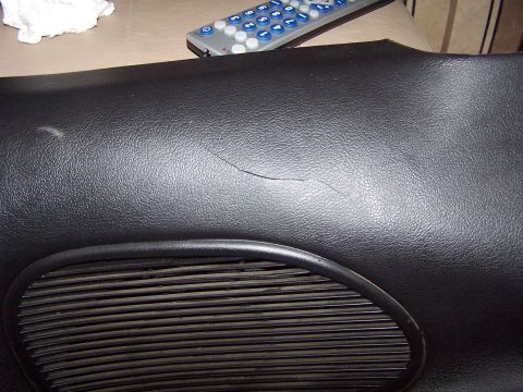 1994 Ford Probe - A crack is visible on the black dashboard surface, near a ribbed speaker grille.