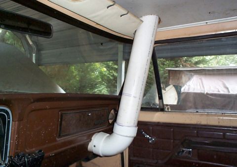 1979 Ford F-150 - Interior view looking out the passenger side of a truck cab with brown door panels and a tan headliner, showing a home-built snorkel made f…