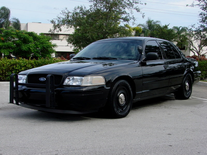 Black 1998 Ford Crown Victoria police car with push bumper