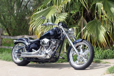 2005 Big Dog Mastiff - A custom chopper motorcycle with a black finish and chrome details is parked outdoors.