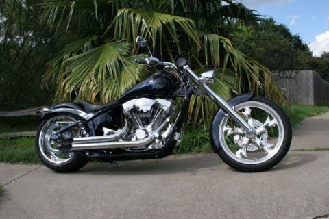 2005 Big Dog Mastiff - A custom black motorcycle with chrome details is parked outdoors.