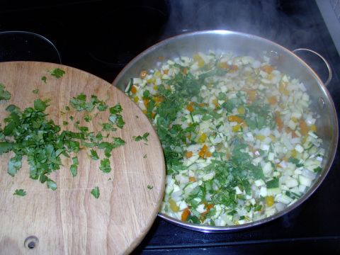 1986 Ford Bronco - Add in the Cilantro (Corriander) too. I keep the remainder, you see on the board, to add into the sauce just before serving.