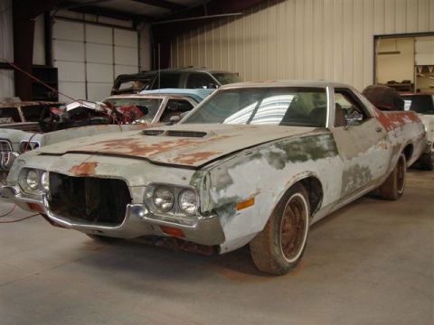 1972 Ford Ranchero - This 1972 Ford Ranchero is in a state of disrepair, with visible rust and missing body panels.