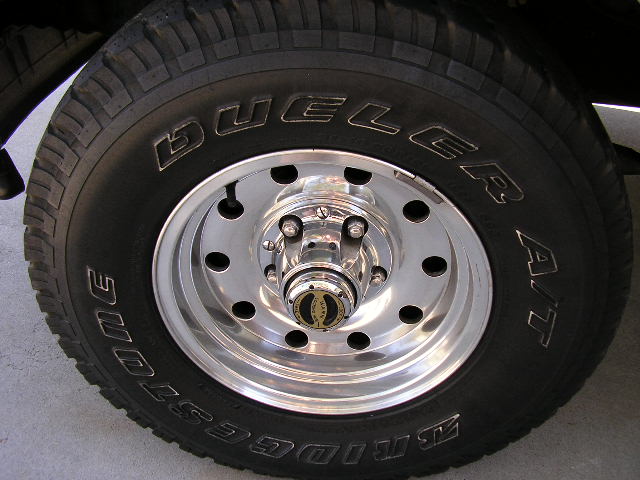 Close-up of a Bridgestone Dueler A/T tire on a chrome wheel