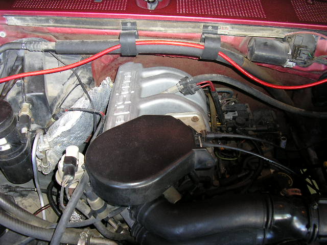 Engine bay with intake manifold and wiring