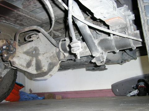 1994 Ford Bronco - Close-up of the rear suspension and differential assembly of a vehicle.