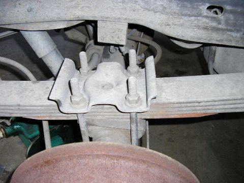 1994 Ford Bronco - Underside view of a vehicle's suspension system, focusing on the leaf spring assembly.