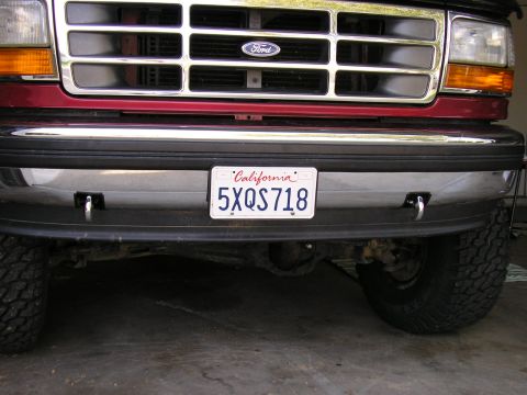 1994 Ford Bronco - Front view of a 1994 Ford Bronco, showing the grille, bumper, and license plate.