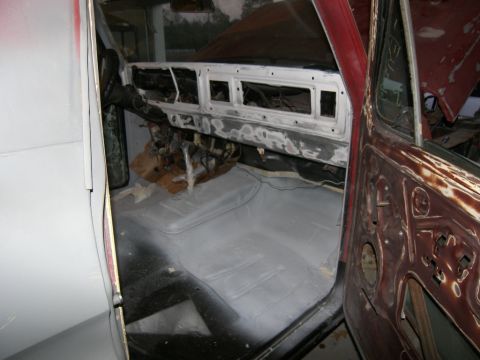 1978 Ford Bronco - The interior of a 1978 Ford Bronco shows a disassembled dashboard and floor, ready for restoration work.