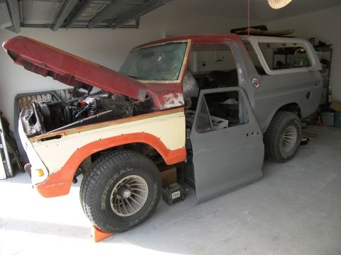 1978 Ford Bronco - This Ford Bronco is undergoing restoration, with its engine exposed and body panels detached.
