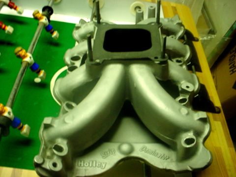 1990 Ford F-250 - Close-up of a Holley Dominator intake manifold, a part for a vehicle.