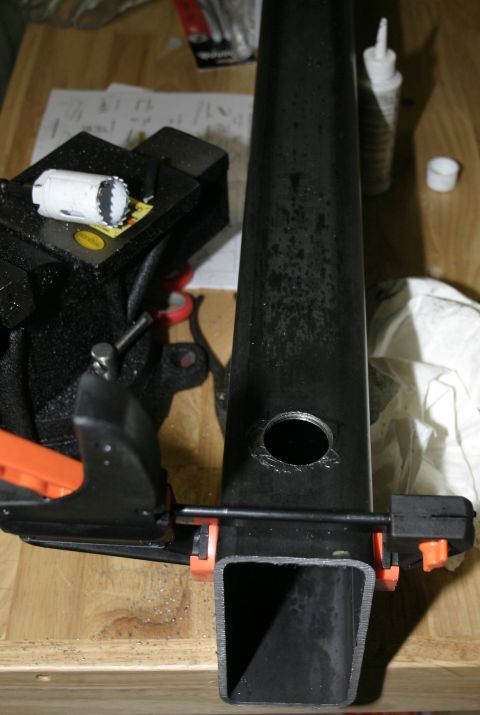 1994 Ford Bronco - Metal tubing is being worked on with a hole saw and vise.