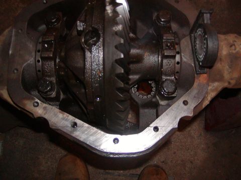 1991 Ford Bronco - Close-up view of a vehicle's differential gears and housing, likely during maintenance or repair.