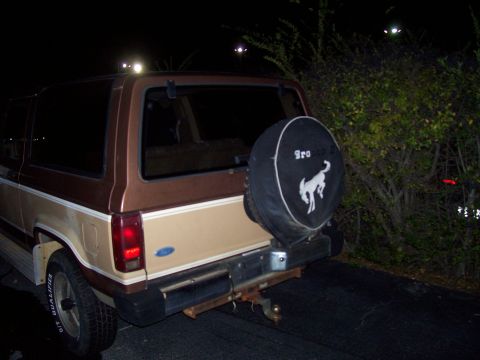 1984 Ford Bronco II - Rear view of a 1984 Ford Bronco II, equipped with a spare tire cover a bronco emblem.