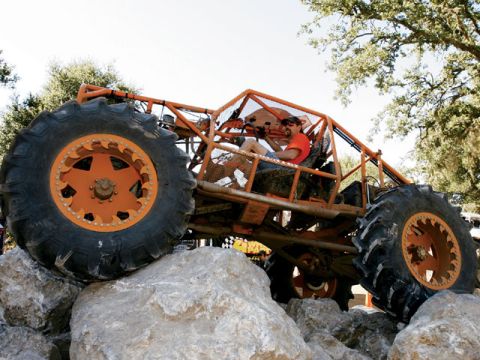1973 Ford Bronco - This custom off-road buggy navigates a rocky terrain with its massive tires.