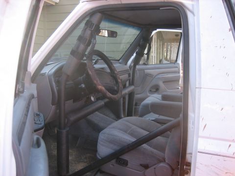 1996 Ford Bronco - Interior view of a 1996 Ford Bronco, modified with a roll cage.