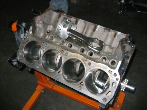 1992 Ford Mustang - Engine block assembly with one piston and connecting rod. The cylinders appear to be bored out.