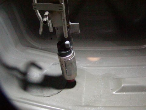 1991 Ford Bronco - Close-up view of a fuel pump assembly, likely from within a vehicle's fuel tank.