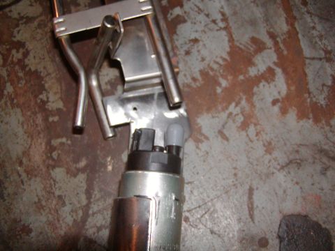1991 Ford Bronco - Close-up of a fuel pump assembly, likely for a vehicle's fuel system.