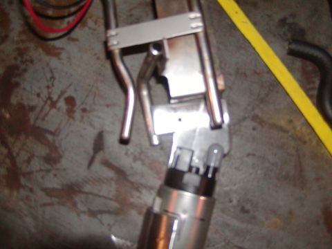 1991 Ford Bronco - Close-up of a fuel pump assembly, likely for automotive use.