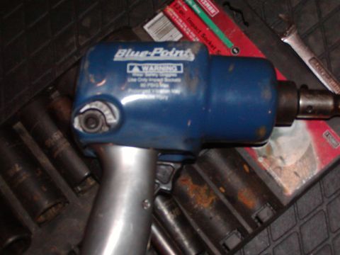 1991 Ford Bronco - A Blue-Point impact wrench is shown with various sockets and a red Craftsman box.