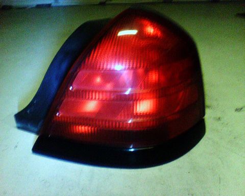 2000 Ford Crown Victoria - A single red taillight assembly is shown from an angled perspective.