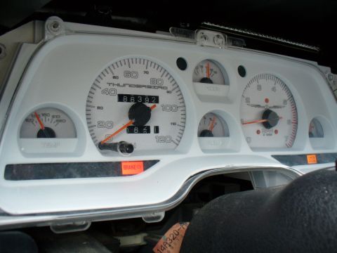 1995 Ford Thunderbird - The dashboard displays 'THUNDERBIRD' and a lit brake warning light, indicating a model year around 1994.