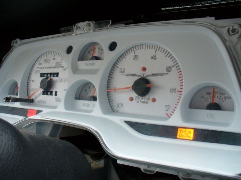 1995 Ford Thunderbird - The dashboard gauges show 'THUNDERBIRD' and a 'CHECK ENGINE' warning light is illuminated.
