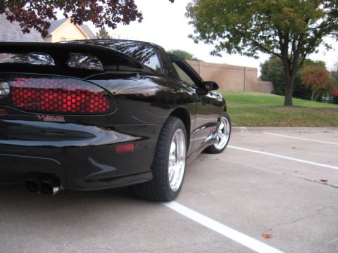 2002 Pontiac Trans Am - Rear view of a black 2002 Pontiac Trans Am with distinctive honeycomb taillights.