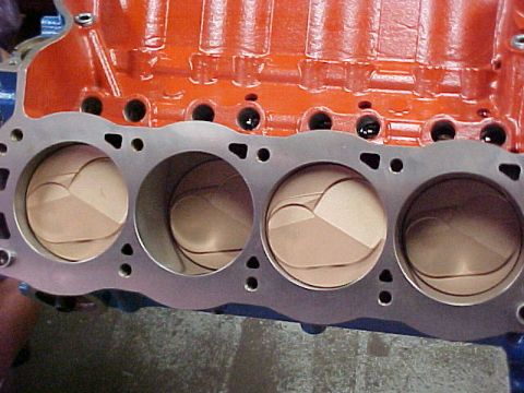 1968 Ford Mustang - Close-up view of an engine block showing pistons within the cylinders.