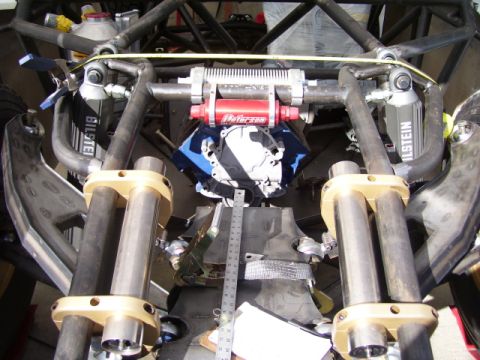 1968 Ford Mustang - Close-up of custom suspension and engine components on a modified vehicle, likely for off-road use.