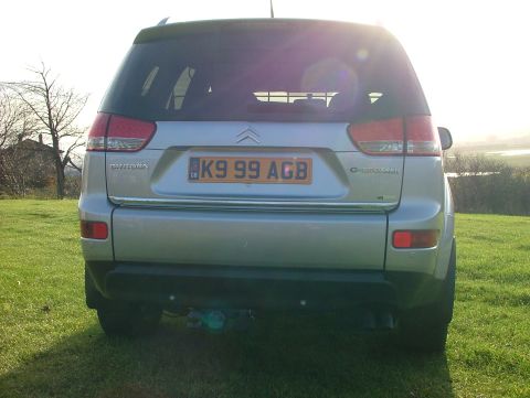 2007 Citroen C-Crosser - Rear view of a 2007 Citroen C-Crosser SUV, showing its taillights and license plate.