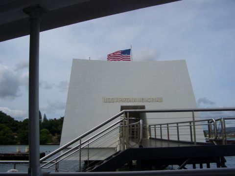 1985 Ford Bronco - The USS Arizona Memorial stands as a tribute, with an American flag overhead.