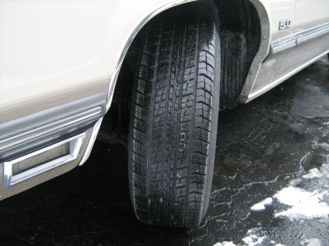 1988 Mercury Grand Marquis - The '5.0' badge on this 1988 Mercury Grand Marquis is visible near the wheel well.