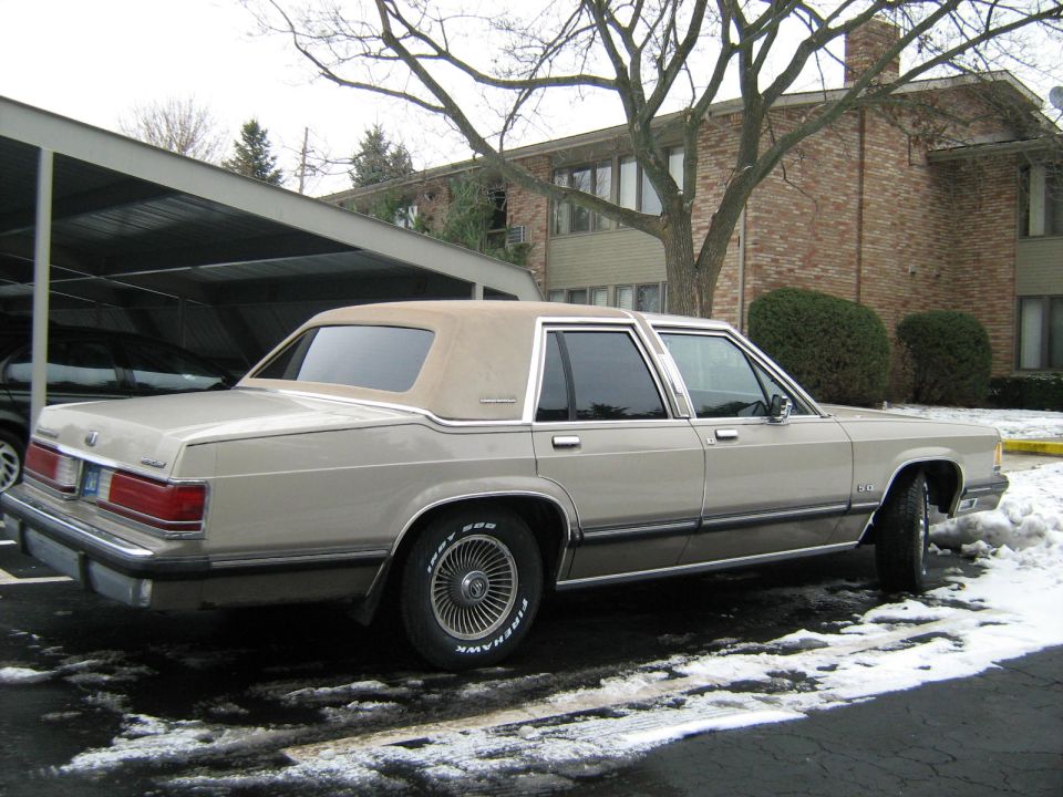 1988 Mercury Grand Marquis parked in snow, side view
