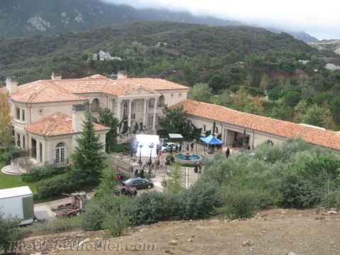 1968 Ford Mustang - A film crew sets up equipment and vehicles in the courtyard of a large mansion.