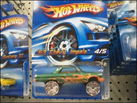 2004 Ford F-150 - Multiple Hot Wheels toy cars are displayed in their packaging on a retail shelf.