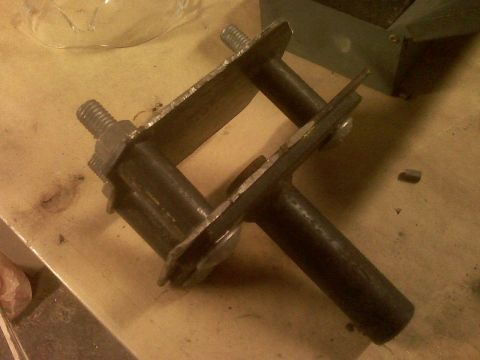 2001 Ford F-150 - Metal bracket assembly with bolts and nuts.