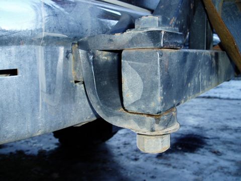 2000 Ford E350 - Detail of a heavy-duty trailer hitch attachment point, showing robust metal construction.