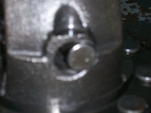 1989 Ford Probe - A close-up view of a metal part with a bolt head.