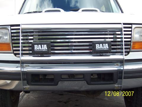 1996 Ford Bronco - Front view of a 1996 Ford Bronco, a chrome grille and Baja auxiliary lights.