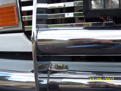 1996 Ford Bronco - A close-up view of a chrome grille guard attached to the front of a white vehicle, with a date stamp of 12/09/2007 visible.