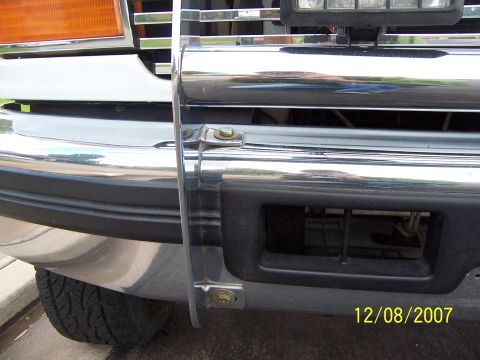 1996 Ford Bronco - The photo shows a close-up of a vehicle's front end, focusing on the grille guard and bumper area.