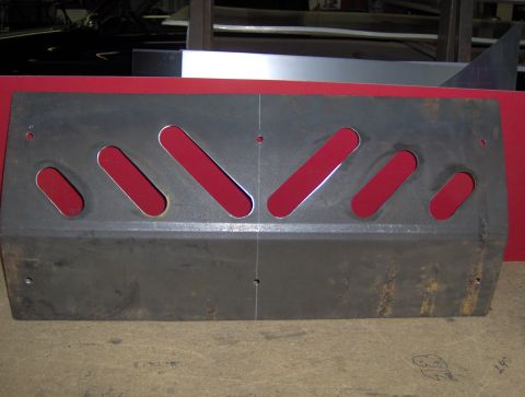 1978 Ford Bronco - A metal skid plate with multiple diagonal cutouts is shown, likely a vehicle part.