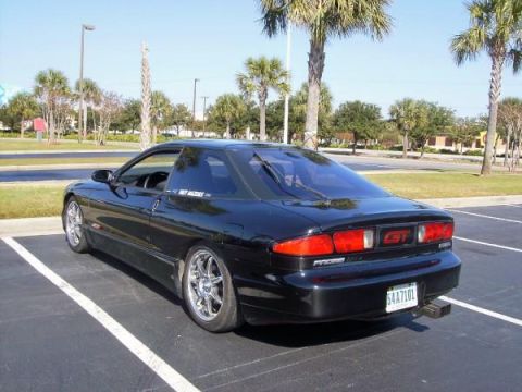 1995 Ford Probe - Rear view of a black 1995 Ford Probe GT with custom wheels.