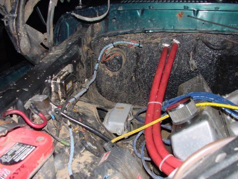 1979 Ford Bronco - Close-up view of the engine bay, showing various wires, hoses, and electrical components.