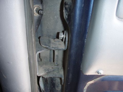 1995 Ford F-150 - The interior door jamb area reveals the door hinge and its attachment points, with visible hardware and trim.