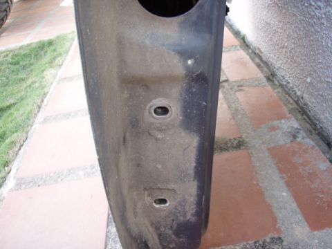 1995 Ford F-150 - Close-up view of the door hinge mounting area on a vehicle part.